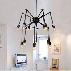 Frida Spider Pendant Light - A black, industrial-style spider chandelier with multiple arms and Edison bulbs. The light hangs above a living room with a TV and a chair, creating a modern and edgy atmosphere.
