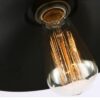 Agda Loft Black English Street Style Pendant Light - A close-up image of a vintage-inspired pendant light with a black metal shade and an Edison bulb. The image highlights the warm, glowing filament of the bulb.