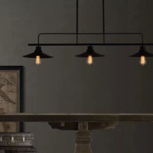 AMBROSE Tri Head Disk Shade Ceiling Light - A black linear pendant light with three cone-shaped shades hangs over a wooden table. The light creates a warm and inviting atmosphere in the room.