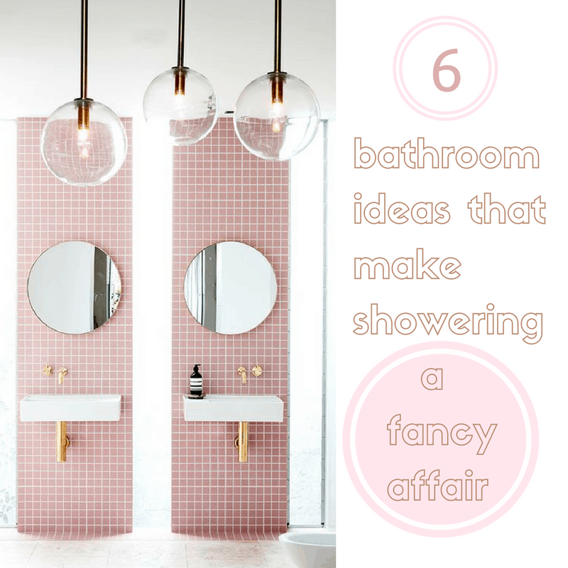 A modern bathroom with pink mosaic tiles, two white sinks, and three hanging globe light fixtures. The text "6 bathroom ideas that make showering a fancy affair" is overlaid on the image.