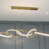 Karolina Elegant Looped Rings Pendant Lamps-background-wall-hanging