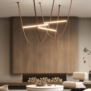 Unipenhas Designer U-Loops Leather Strap Pendant Light - A modern living room with a minimalist aesthetic. A unique leather strap chandelier hangs above a round coffee table, providing soft, ambient lighting. The chandelier features curved leather straps and integrated LED lights, creating a stylish and functional focal point.